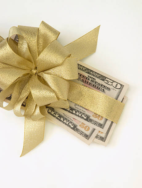 Fifty Dollar Bills with Gold Bow stock photo