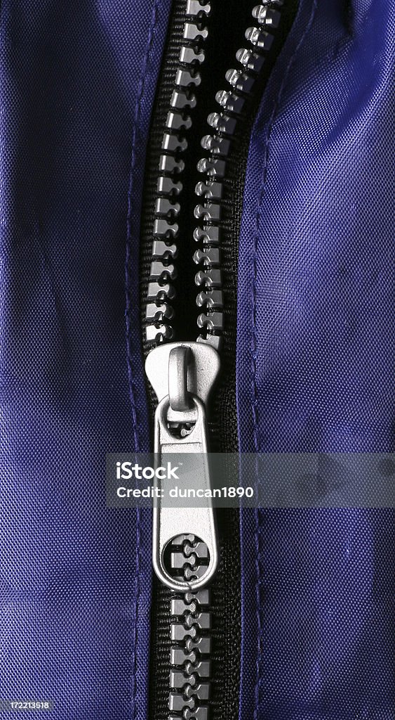 Zip A partly open zip. Backgrounds Stock Photo