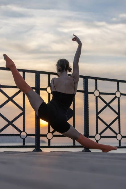 istock Flexible blonde lady is exercising at sunset. 1722140177