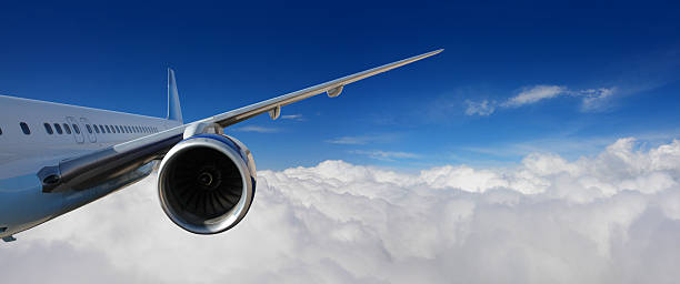 Airplane Flying above the Clouds See my similar photos: aircraft wing stock pictures, royalty-free photos & images