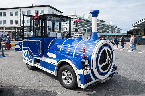 Alesund, Norway - June 10, 2017: trackless train for sightseeing collecting guests from cruise ships