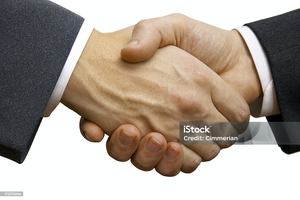 Two businessmen making deal and shaking hands in agreement Businessmen handshake close-up. Isolated on white.  Handshake Stock Photo