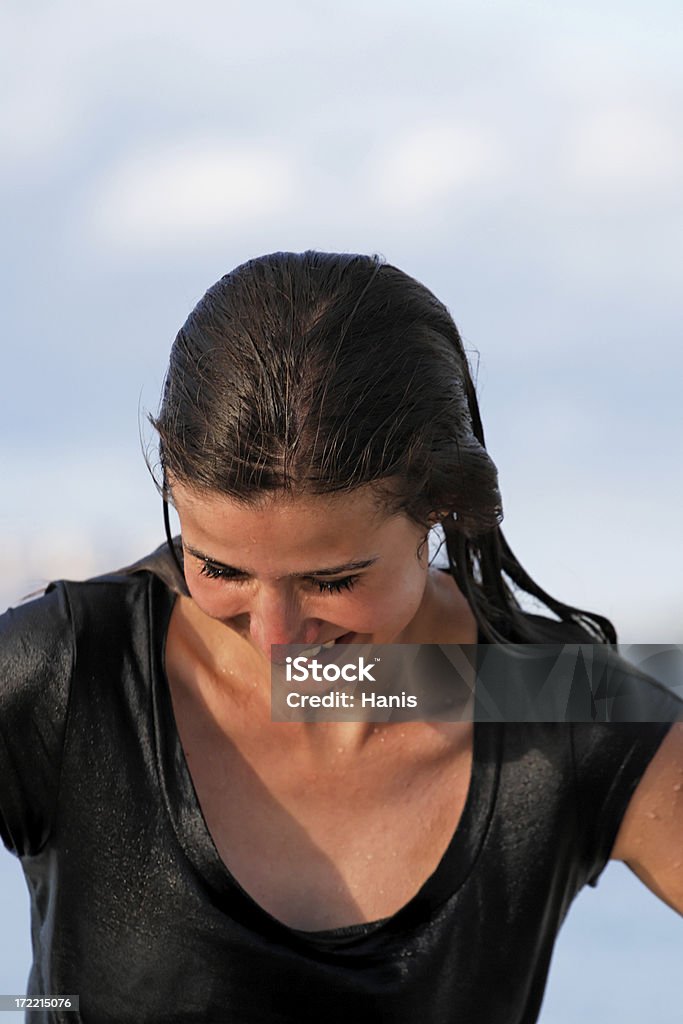 Wet in clothes Beautiful girl all wet in her clothes on a beach in Asutralia Drenched Stock Photo