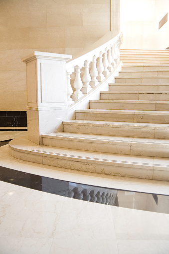 A luxurious, classic white marble staircase