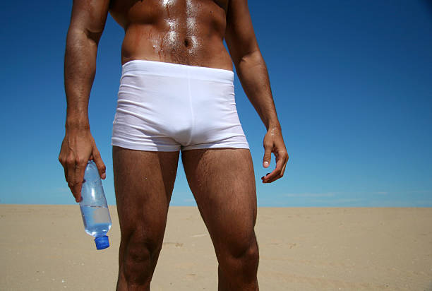 sexy mann - exercising sensuality water bottle relaxation exercise stock-fotos und bilder