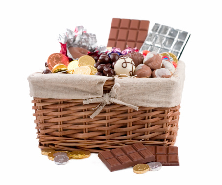 Delicious basket filled with chocolate and candies.  Shallow dof.