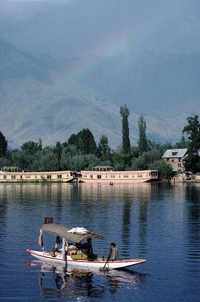 Dal Lake, Srinagar "A shikara and houseboats on the lake in Srinagar, KashmirSee also my other images of" lake nagin stock pictures, royalty-free photos & images