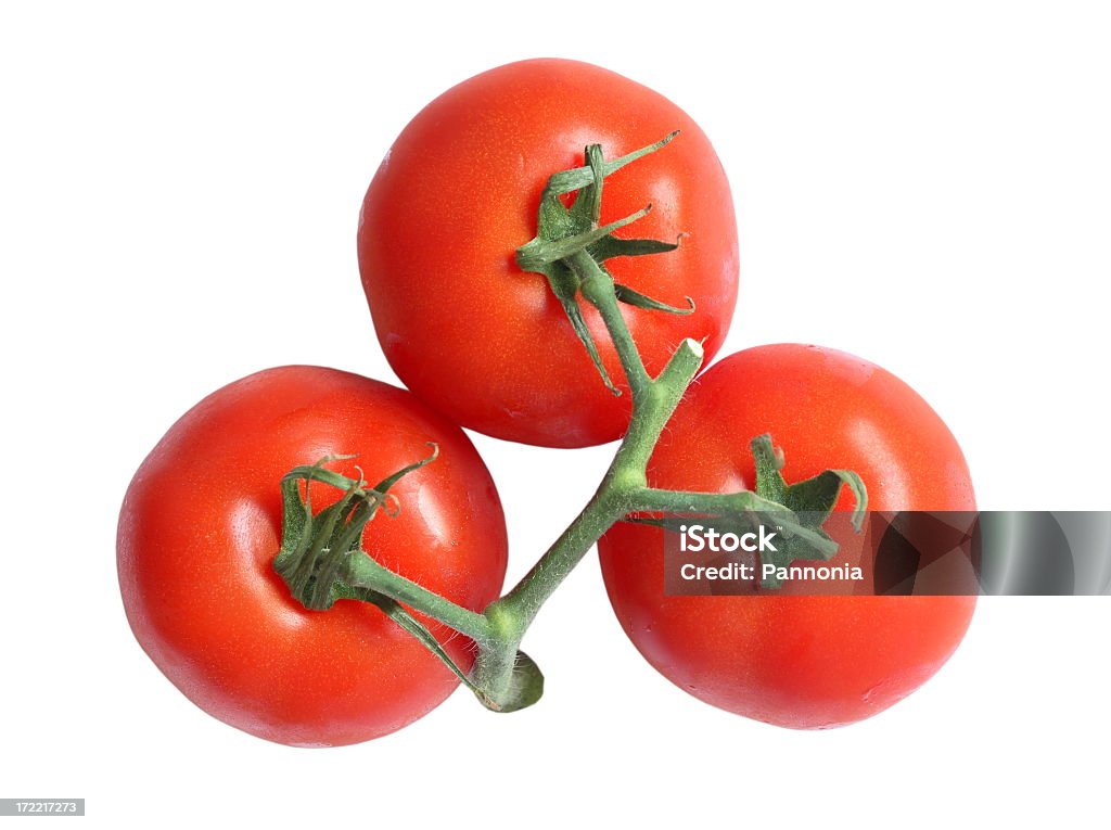 Three tomatoes on vine on white background Tomatoes on white Color Image Stock Photo