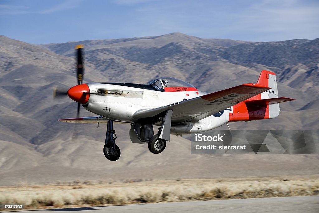 P 51 Mustang P 51 Mustang launching from airport. Gear is retracting as aircraft is just a few feet off the runway.Property Release included for name on side of plane.Click image for Antique Aircraft Lightbox Air Vehicle Stock Photo