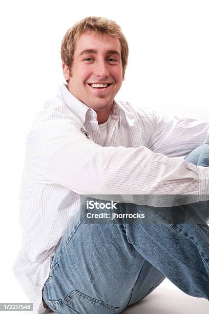 Casual Male Sitting On Floor Stock Photo - Download Image Now - 20-29 Years, Adult, Adults Only