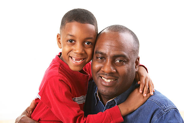 Son hugging Dad stock photo