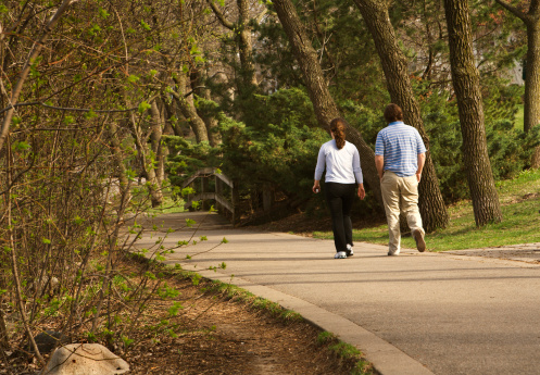 Subject: A young couple taking a walk in a park
