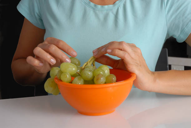 istock Green grapes hand bowl. 1722179757