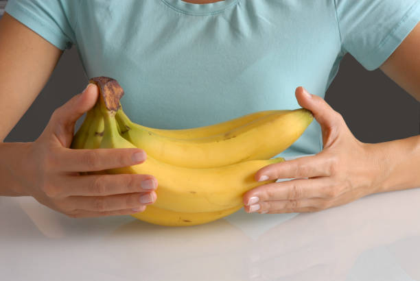 istock Woman banana hands. 1722179767