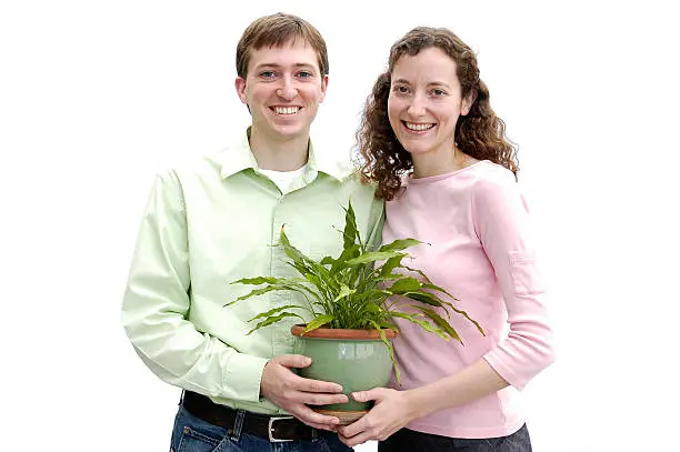 young couple with a plant