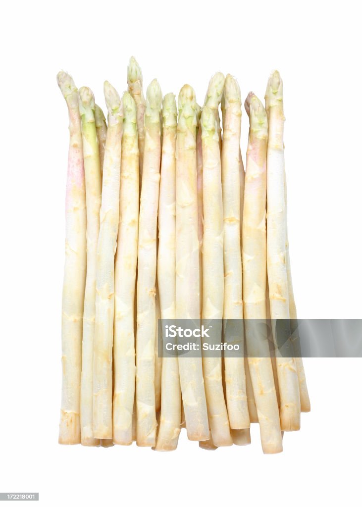 White asparagus isolated on a white background White asparagus (asparagus which has been shielded from the sun to prevent it from turning green). The tips are faintly green. Isolated on white. White Asparagus Stock Photo