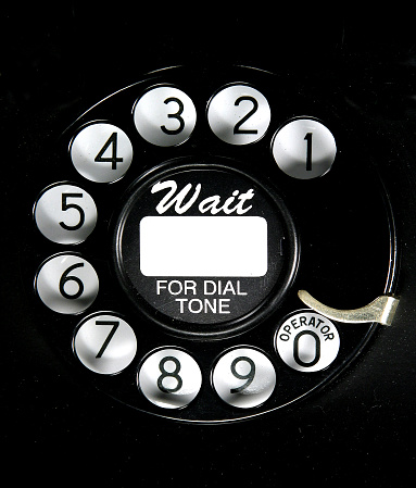 Rotary dial on an old telephone.
