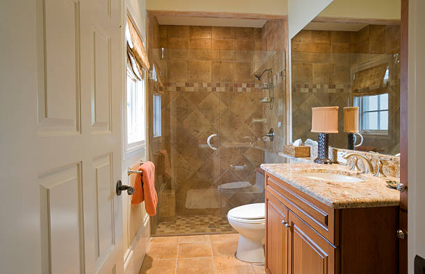Guest Bath Beautiful guest bathroom with granite counter tops and marble floors & shower bathroom designer shower house stock pictures, royalty-free photos & images