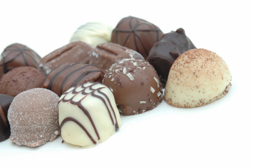 Assorted chocolates on a white background.