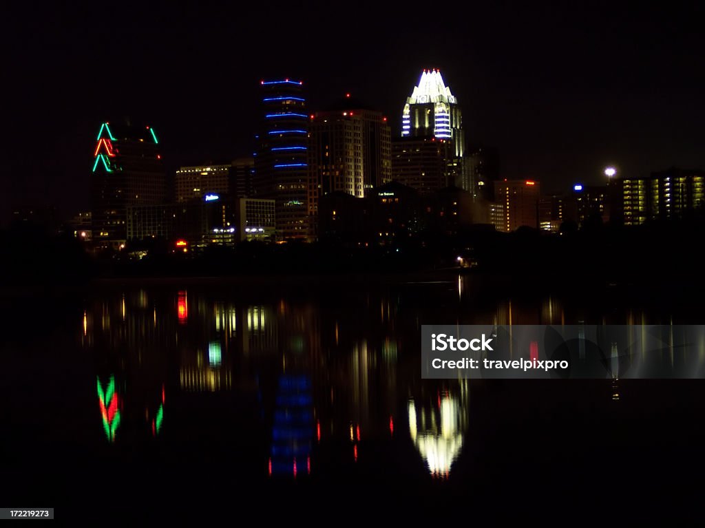 Austin Texas City Nighttime Skyline with Reflections on Town Lake Austin, Texas skyline and reflection in the Colorado river. Exposure is sufficient to render any logos indistinguishable. Austin - Texas Stock Photo