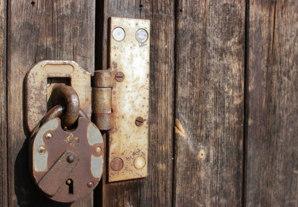 istock Padlock on wooden door 172219353