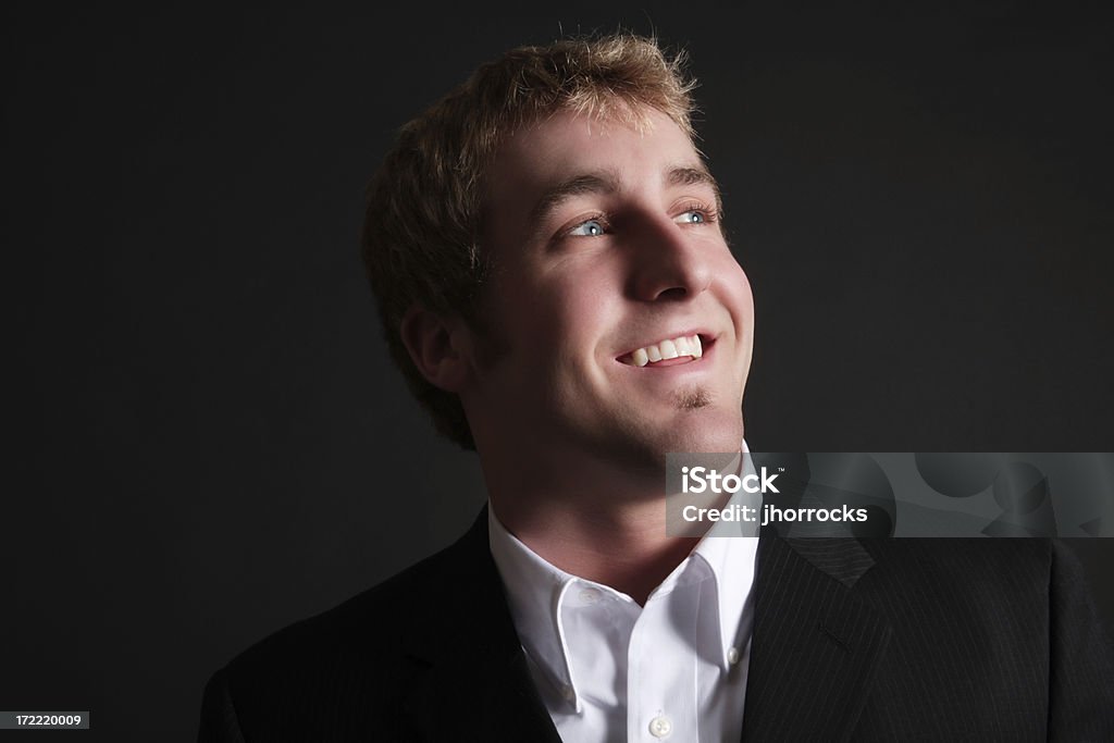 Optimistic Businessman Photo of an optimistic young man looking up. 20-29 Years Stock Photo