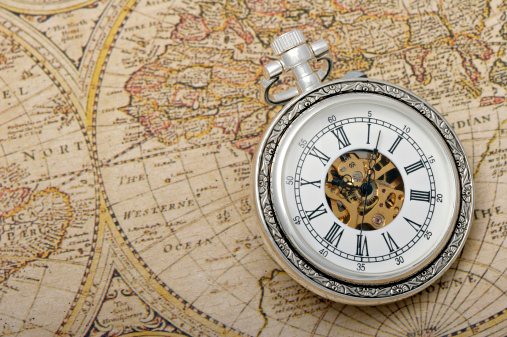 Pocket watch and world map