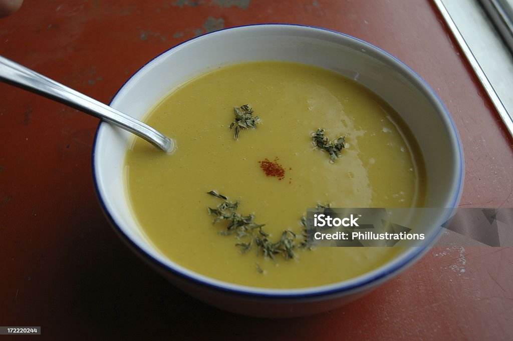 Happy soup Acorn squash soup with a parsley smile. Anthropomorphic Smiley Face Stock Photo