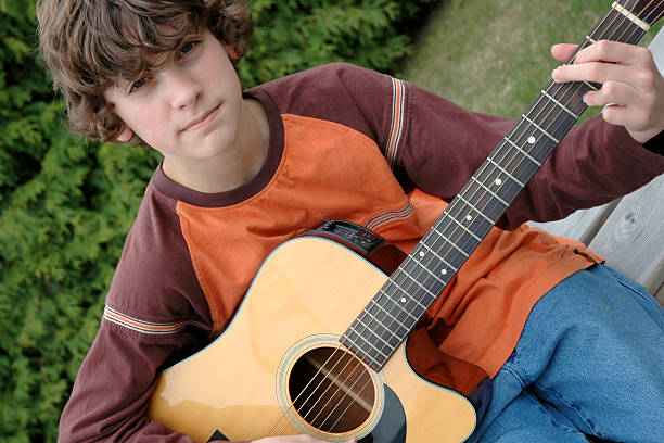 istock Teen and His Guitar 172220343