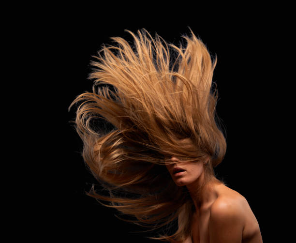 istock young woman with flying hair 1722205566