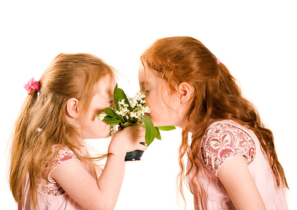 istock Young girls smelling spring flowers 172221060