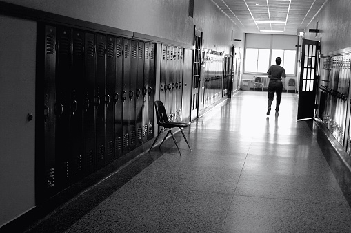 Black and White Photo of a School Hallway