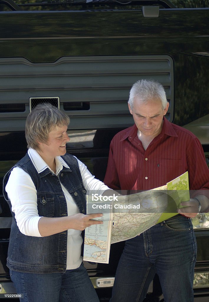 Couple and truck "Couple in middle age standing in front of a truck, more pics:" Husband Stock Photo