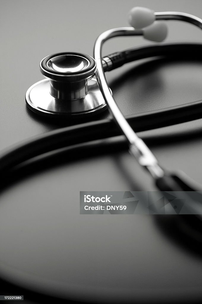 Stethoscope on dark gray surface Doctor's stethoscope Copy Space Stock Photo