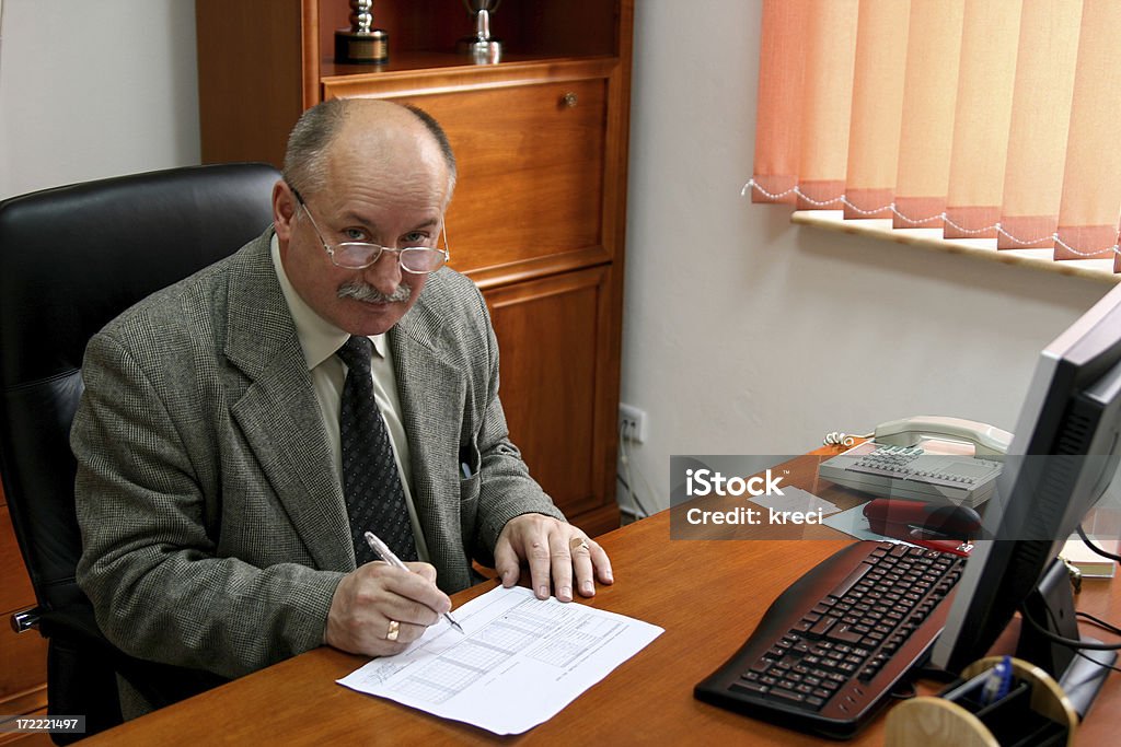 Smiling businessman Smiling businessman in his office.Similar photos: 50-59 Years Stock Photo