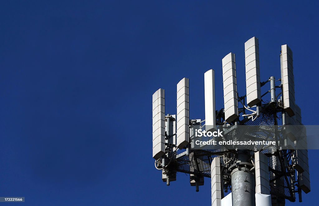 Cell tower standing in the blue sky Mobile Phone Tower with strong blue sky Telecommunications Equipment Stock Photo