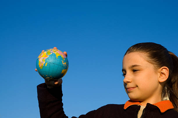 istock little girl and world 172222282