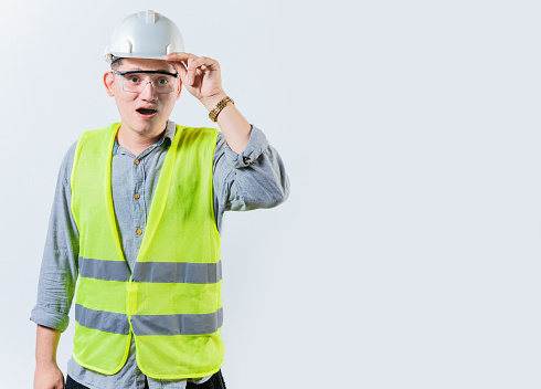 Amazed engineer looking into the distance isolated. Young engineer looking at something in the distance. Surprised man engineer looking into the distance