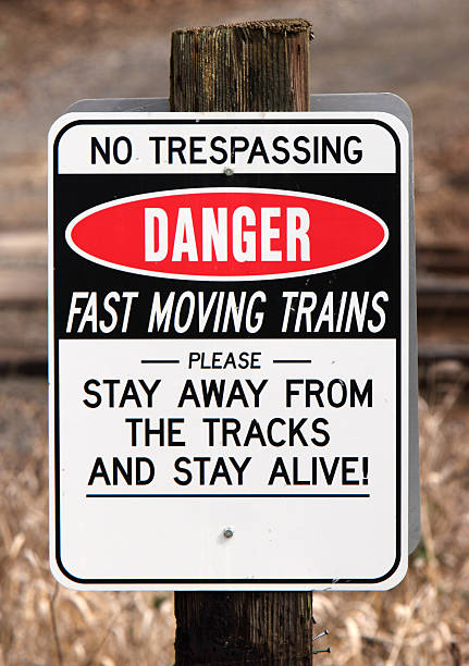 Danger Fast Moving Trains Sign stock photo