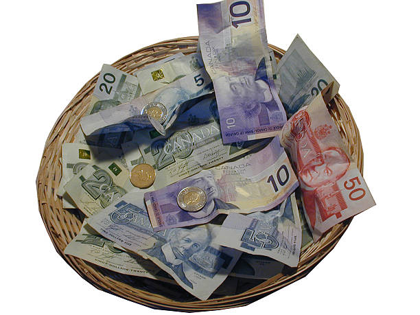 Collection Basket Collection Basket full of Canadian Currency canadian coin stock pictures, royalty-free photos & images