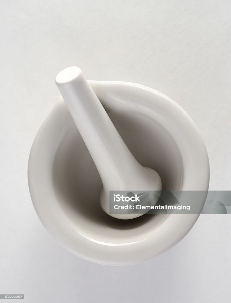 Mortar and Pestle 2 A mortar and pestle on a neutral background. Ceramics Stock Photo