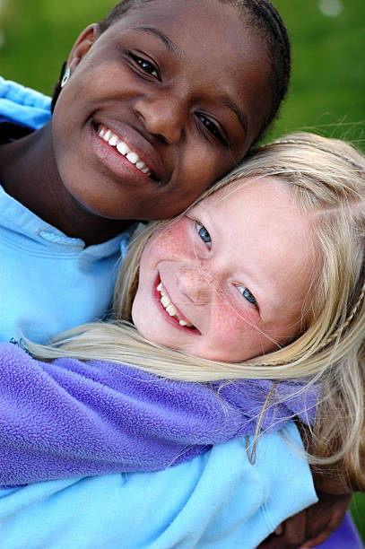 istock Two Happy Girls Smiling and Hugging Each Other 172223140