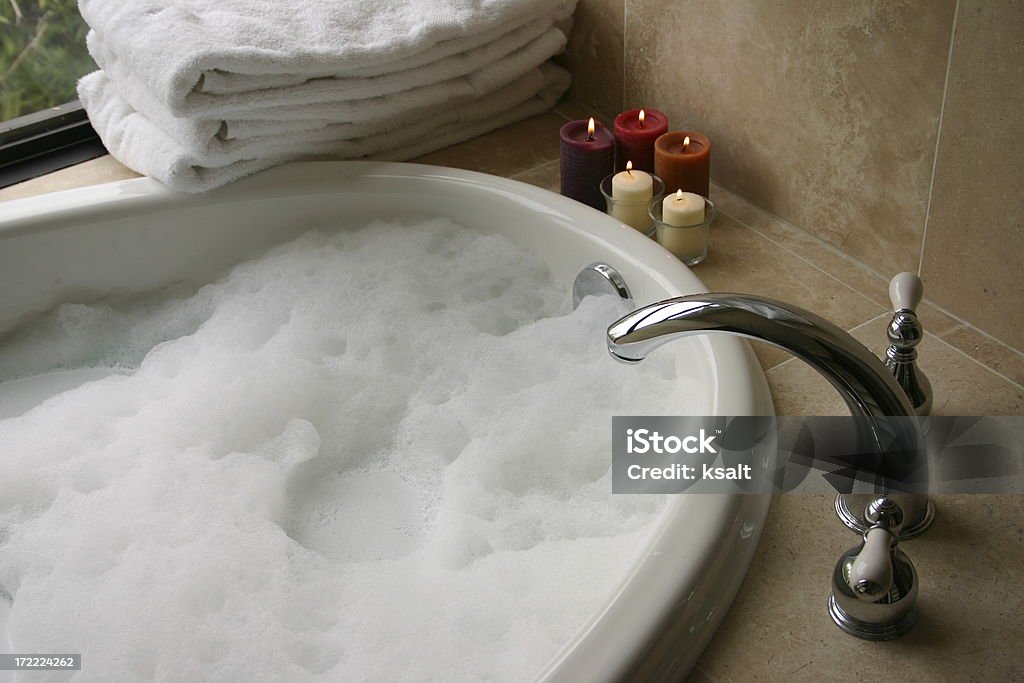 bubble bath with candles, towels "bubble bath with candles, towels" Bathtub Stock Photo