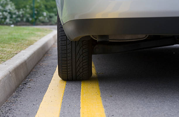 No Parking - Silver Car Double Yellow Lines curb photos stock pictures, royalty-free photos & images