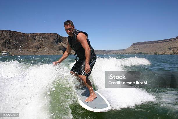 Surfing The Wake Stock Photo - Download Image Now - 30-39 Years, Active Lifestyle, Activity