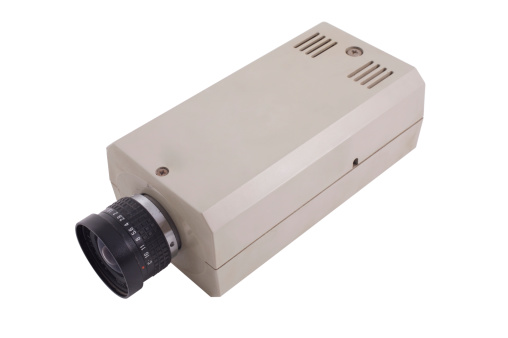 Retro CCTV camera on a white background