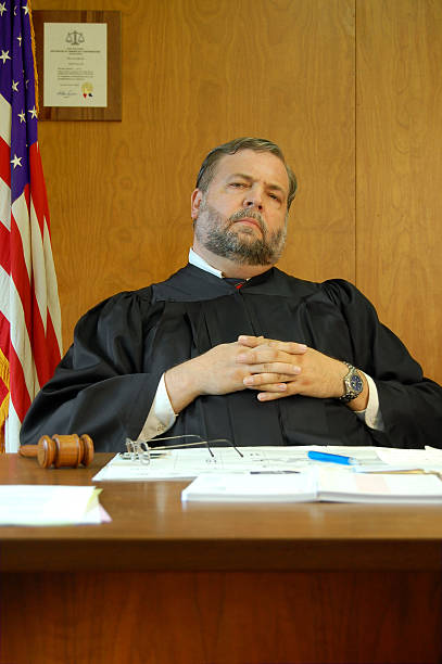 istock Fat Judge Sits Back And Listens 172224641