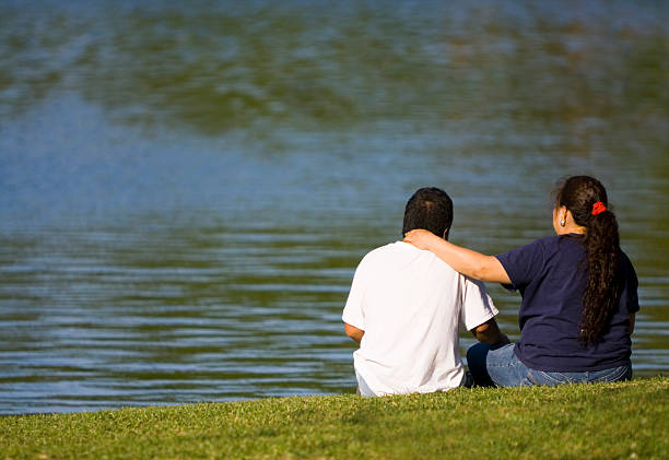 Hispanic Couple At Lake stock photo