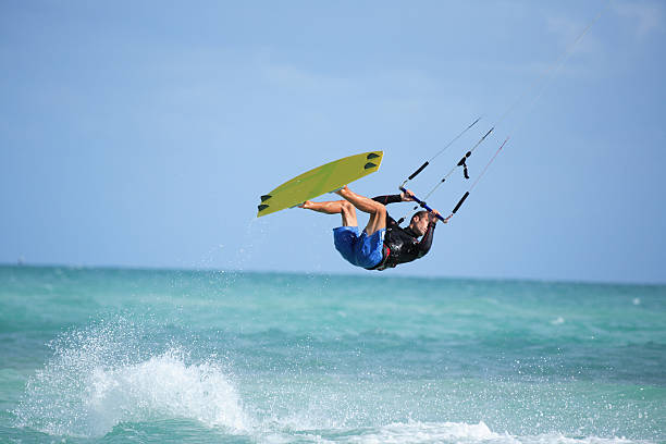 kite man kite boarder flying through the air kiteboard stock pictures, royalty-free photos & images