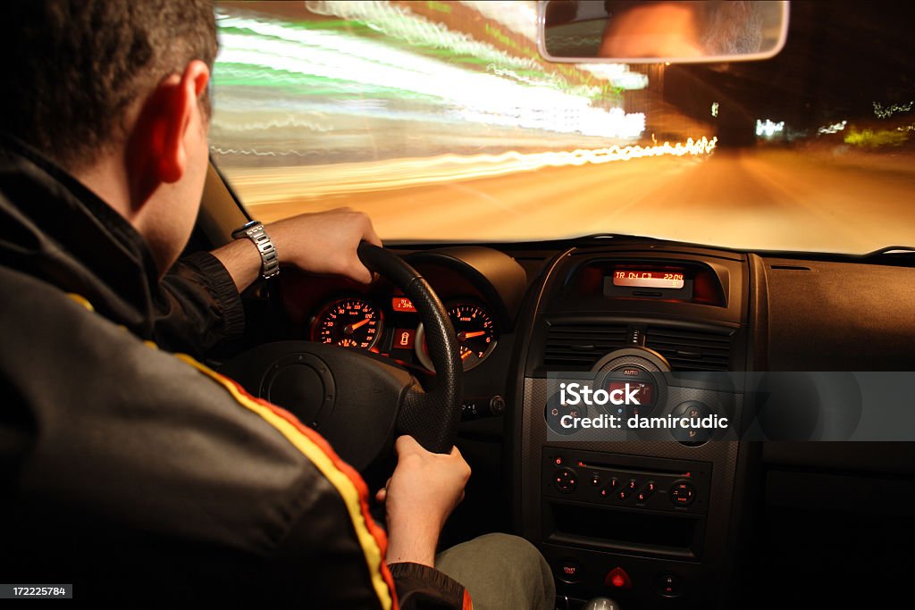 Fast night drive The photo shows a man driving a sports car  Car Stock Photo